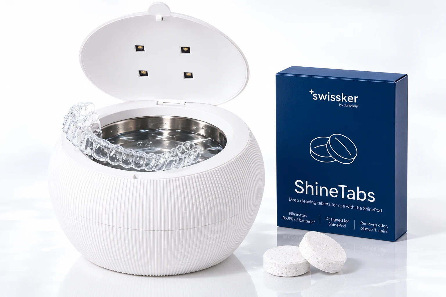 Open ShinePod with clear retainer, ShineTabs box and cleaning tablets